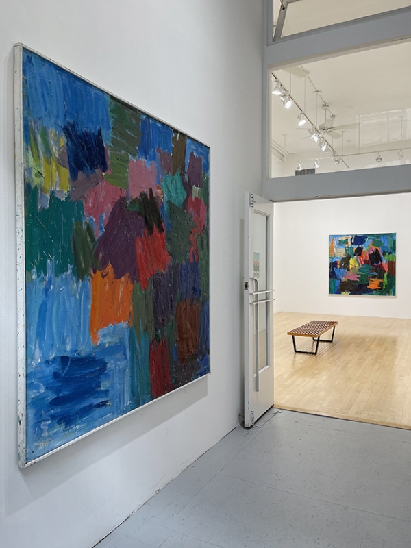 installation of large colorful abstract paintings