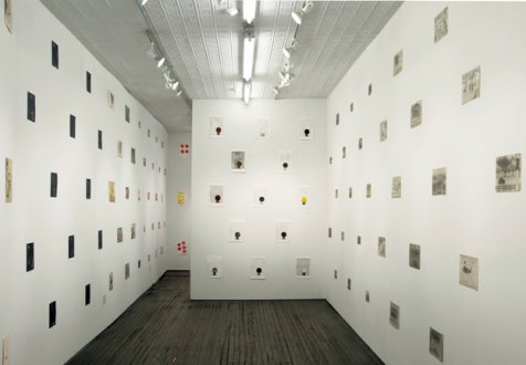 installation view of exhibition many drawings on walls