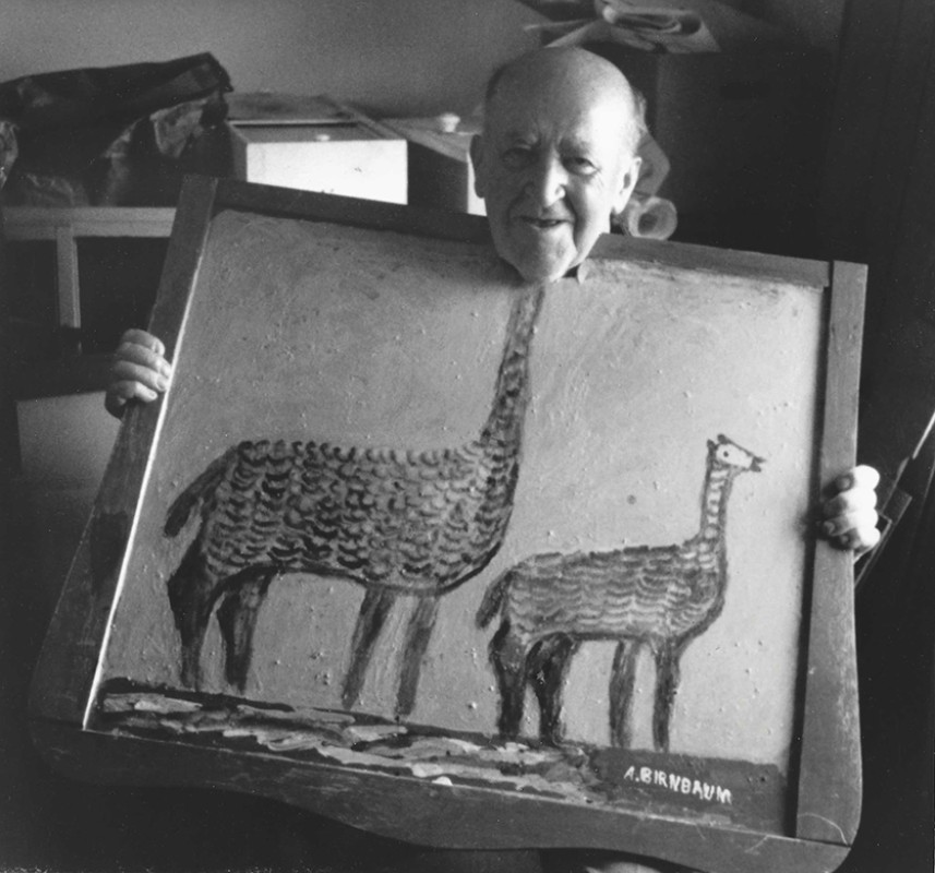 photo of older man holding painting with cutout for head
