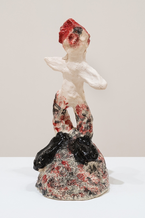 ceramic figure with red hair