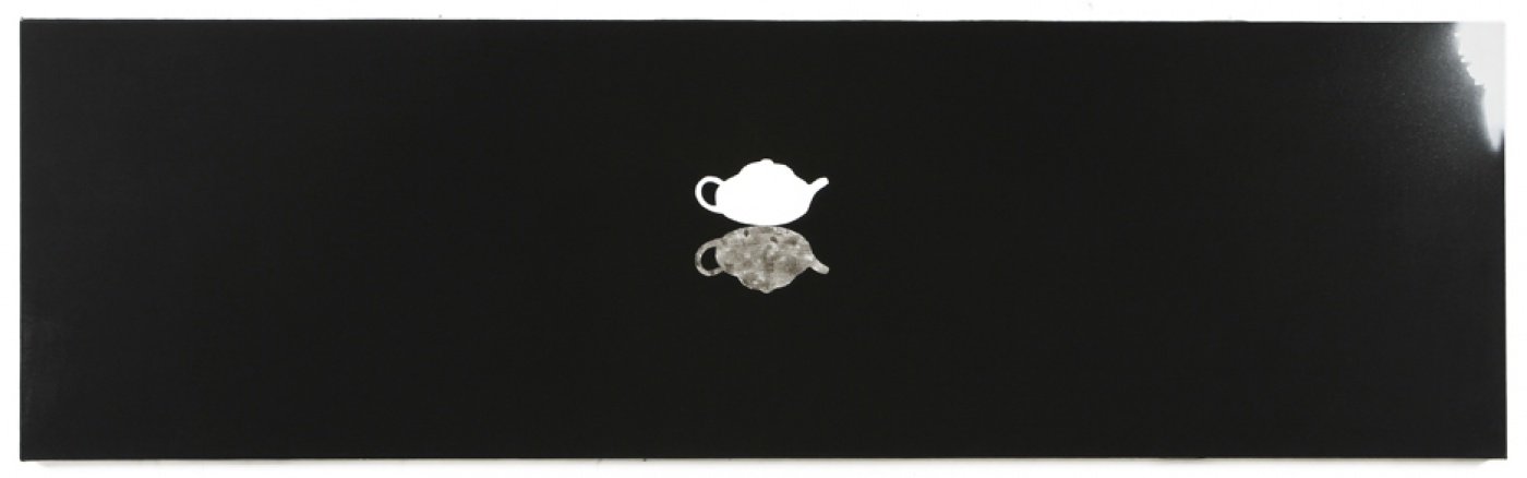 black background and white teapot