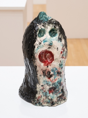 ceramic bust with black hair