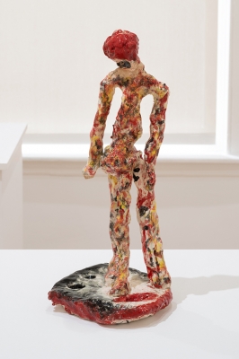 tall ceramic figure with red hair