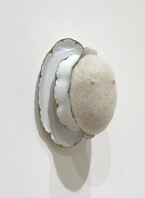 sculpture made with porcelain vessel and wool