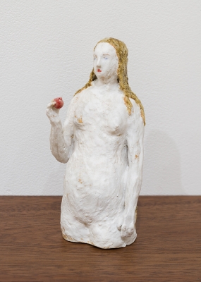 white figure with apple