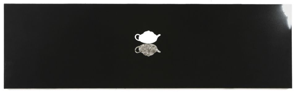 black background and white teapot