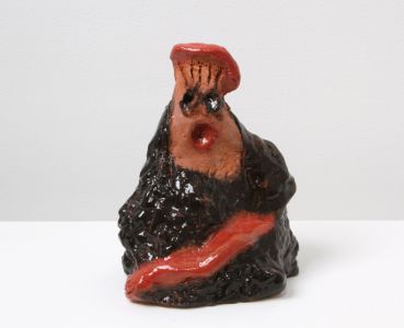 figure made out of red clay